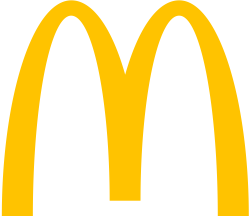 Golden arches forming the letter "M" on a black background, representing a popular fast-food brand.
