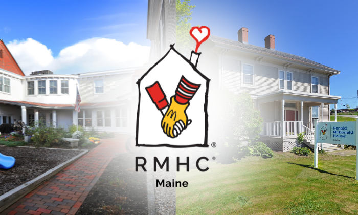 Ronald McDonald House in Maine with logo, featuring a welcoming exterior and green lawn on a sunny day.